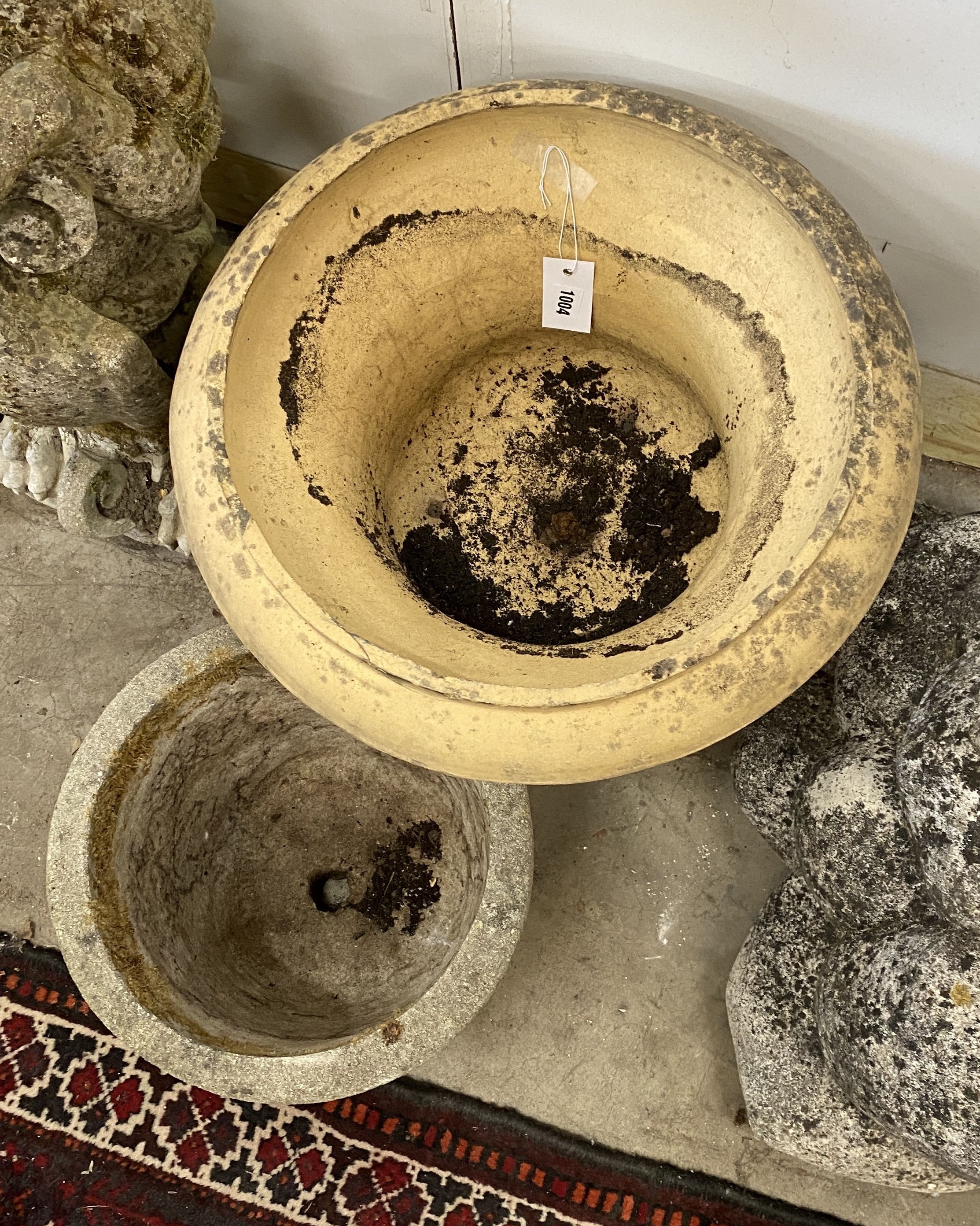 An earthenware campana garden urn, diameter 45cm, height 42cm together with a smaller reconstituted stone garden planter